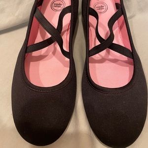 Black ballet slippers with elastic straps